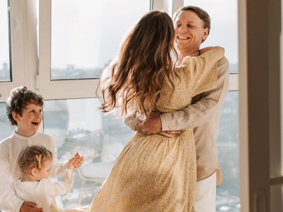 A family gathered around a window