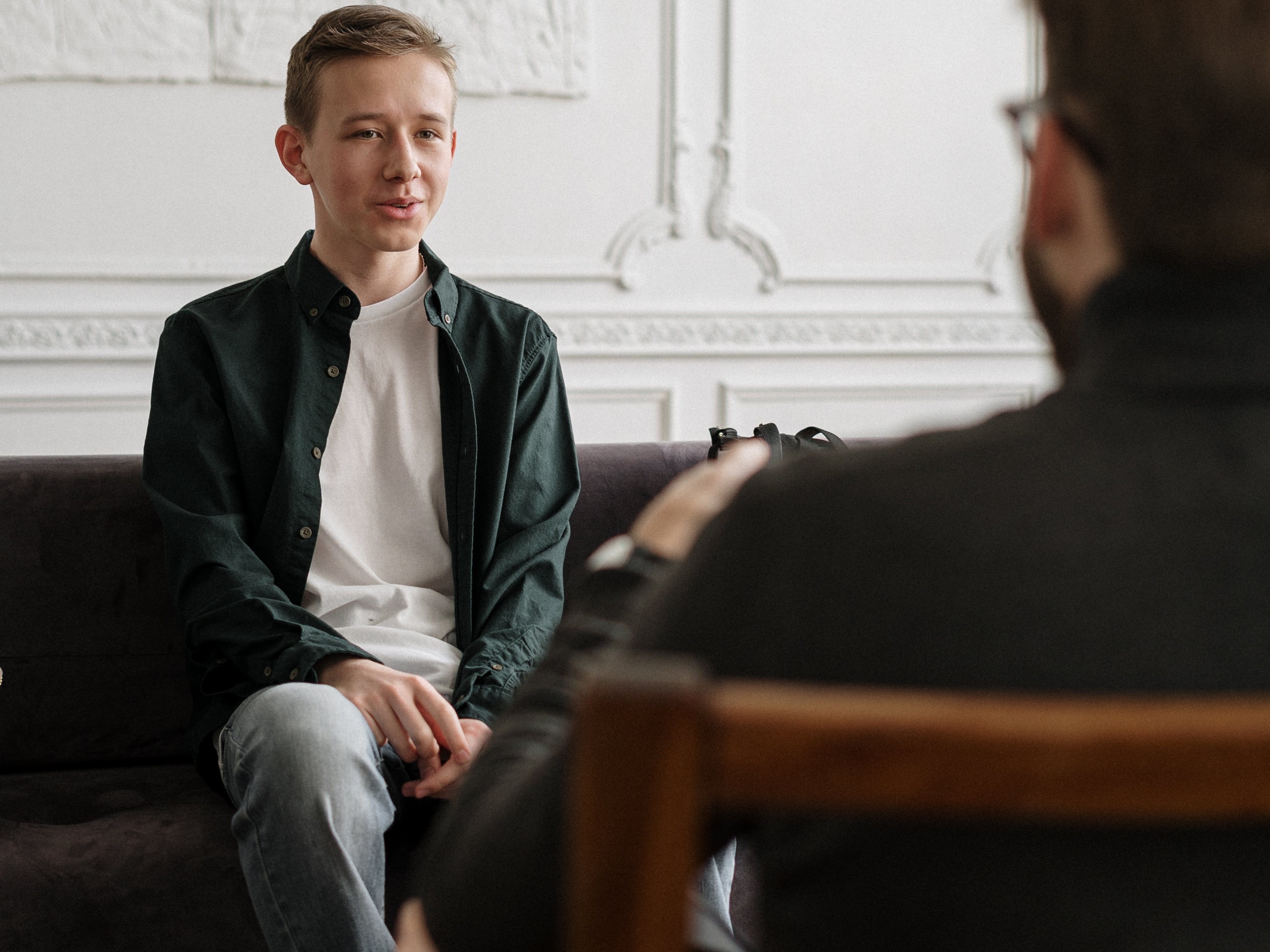 Young man sitting on a chair